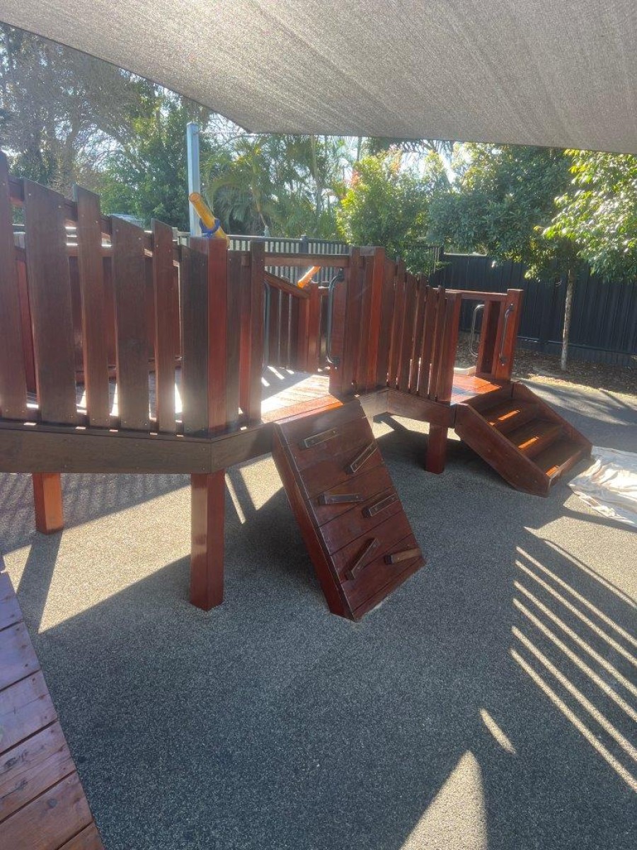 Maintenance painting of outdoor play equipment